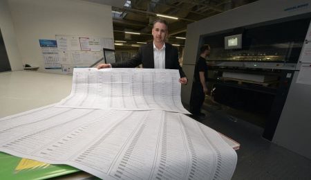 Sven Hochleitner holds printed ballot paper